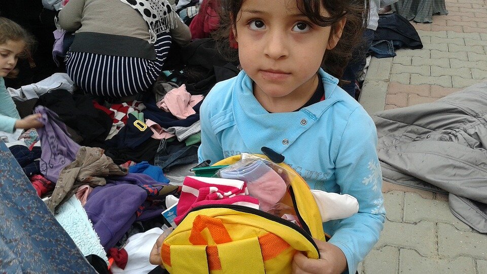 Implores Syrian refugees to come home