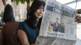 A woman reading China Daily