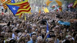 Pro-independence demonstrators cheer outside the Catalan parliament, in Barcelona, Spain