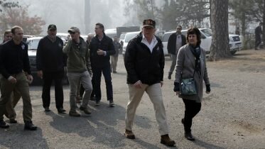 Trump visits burnt town
