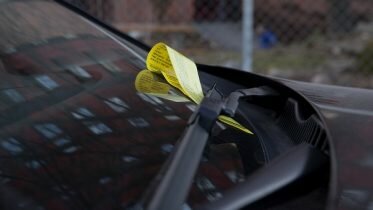 Two men beat up the parking guard after they got a fine