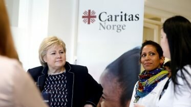 Solberg praises Catholic relief organization